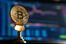 bitcoin trophy with chart on the background
