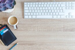 keyboard with coffee mug and pursue