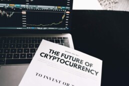 future of cryptocurrency book with laptop