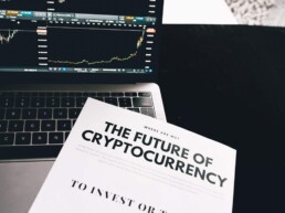 future of cryptocurrency book with laptop
