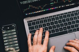 guy checking crypto exchange on laptop