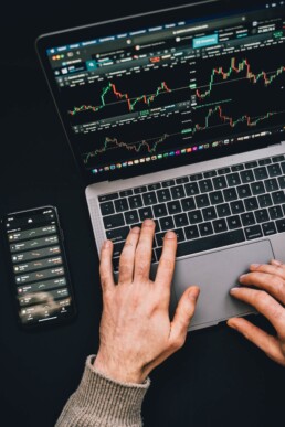 guy checking crypto exchange on laptop