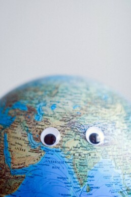 world map ball with eyes