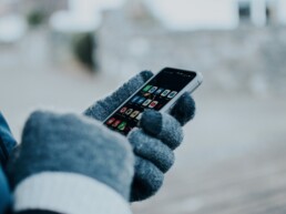 girl using phone in winter weather