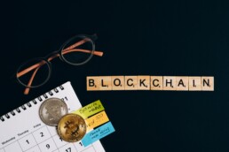 blockchain with physical coin and glasses