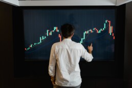 guy checking crypto graphic