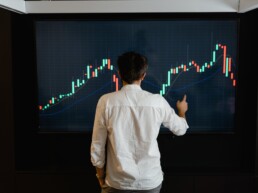 guy checking crypto graphic