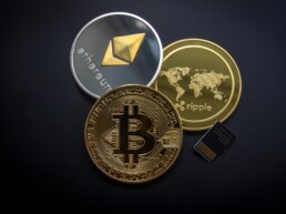 ethereum ripple and bitcoin physical coin on the dark ground