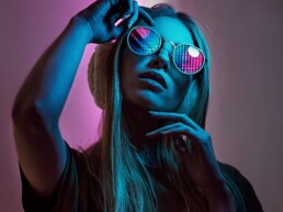 pretty girl with neon light in the face